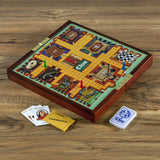 Clue board game on a wooden surface with cards and a suspect card.