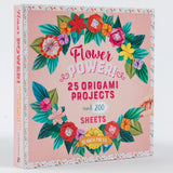 The front and spine of the book 'Flower Power! 25 Origami Projects and 200 Sheets' by Search Press, featuring a pink cover decorated with colorful origami flowers and leaves.