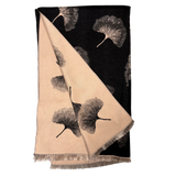 Black and tan scarf with gingko leaf designs on a plain white background