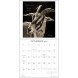 A vertical wall calendar page showing a black-and-white goat portrait with a quote at the top and the November 2027 calendar grid below on a white background.