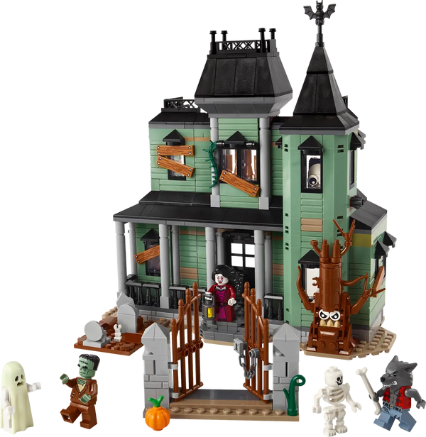 LEGO haunted mansion set with monsters on white background
