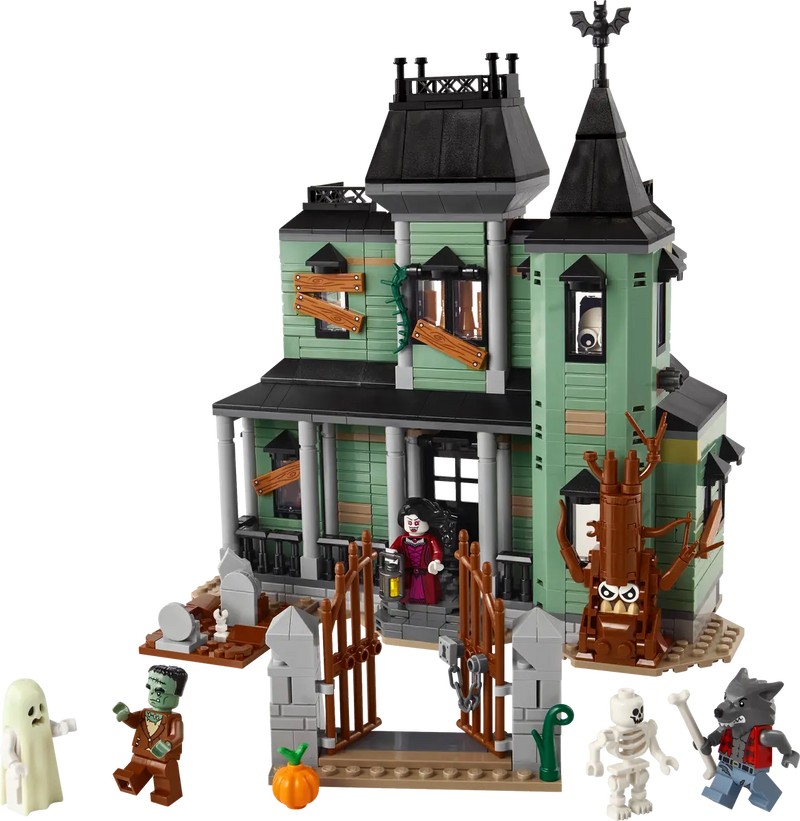 LEGO haunted mansion set with monsters on white background