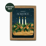 Boxed set of Solstice cards with candles and festive design on a white background