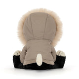 Black and white plush cat toy wearing a khaki parka with fur trim.