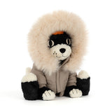 Black and white plush cat toy wearing a khaki parka with fur trim.
