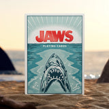 Jaws playing cards packaging with shark illustration on a beach background