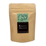 A kraft paper stand-up pouch with a front label reading 'Kakawa's American'  shown on a plain white background.