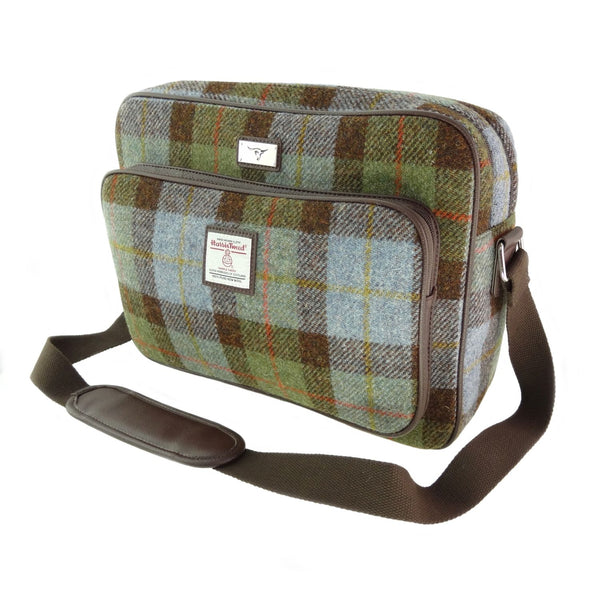 Plaid patterned bag with a strap on a white background