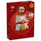 LEGO 40813 Chinese New Year Lucky Cat building set in its original red packaging, featuring a white cat with pink ears and feet, a gold bell, and a red collar.