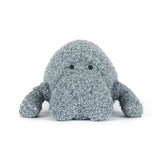 Plush toy Manatee with textured surface on a white background