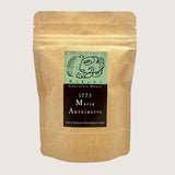 A kraft paper stand-up pouch of Kakawa Chocolate House 1775 Marie Antoinette chocolate, shown against a white background.
