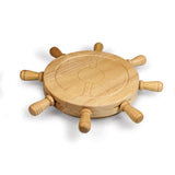A round wooden ship's wheel serving tray with eight spokes and a wheel engraved in the center, shown on a white background.