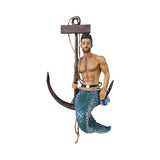A decorative figurine of a bearded man with dark hair, shown shirtless with a blue-green mermaid tail, holding a large anchor and rope with a wooden top piece, isolated on a white background.