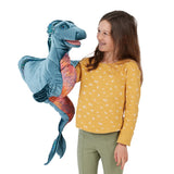 Girl holding a large blue and orange plush dragon toy on a white background