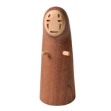 A wooden bottle opener shaped like the character No-Face from Spirited Away, photographed against a plain light background.