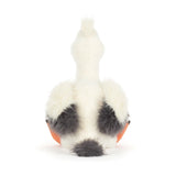 Plush pelican toy with a white body, orange beak, and feet on a white background