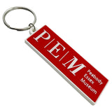 Red rectangle silicone keychain with metal ring and text.