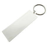 Rectangle silicone keychain with metal ring and text.