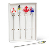 Set of novelty cocktail stirrers with colorful ends in a display box.