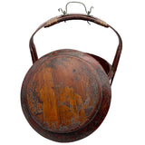 Vintage Chinese basket crafted of wood with a bamboo handle. Painted red with faded imagery.