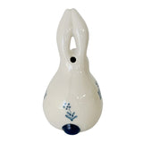 A white ceramic rabbit figurine with blue painted details.