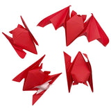 Four red origami bats on a white background
