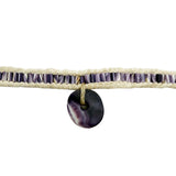 Beige leather necklace with white and purple shell beads on a white background