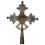 Decorative cross with intricate designs on a white background
