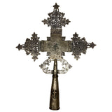 Decorative metal cross on a white background