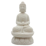 White stone statue of a seated Buddha on a white background