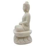 White stone statue of a seated Buddha on a white background