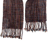 Woven fabric scarf with fringes on a white background