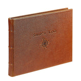 Brown leather notebook with 'Ship's Log' embossed on it against a white background
