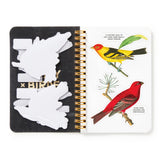 Spiral bound book with bird-themed design and cut-out shapes on a white background