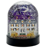 Snow globe with a Halloween-themed scene featuring a house, pumpkins, and ghosts.