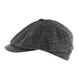 A dark gray and black houndstooth flat cap with a small green and yellow tag on the side, shown against a plain white background.