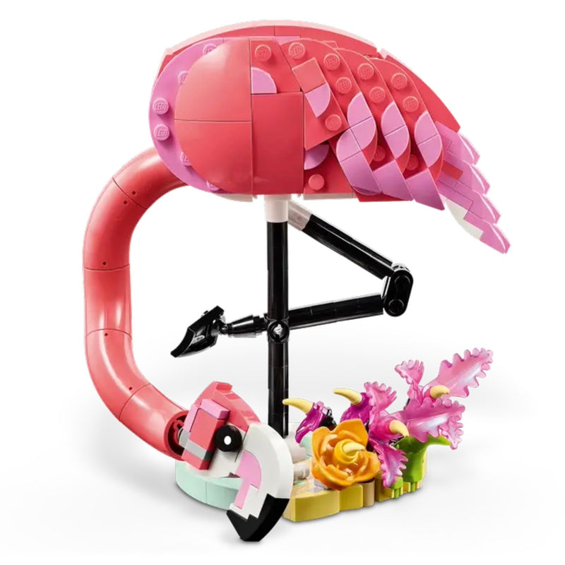 Toy flamingo with pink feathers and a black beak on a white background