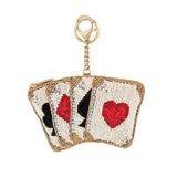 Beaded keychain coin purse with playing card design on a white background