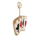 playing card-shaped keychain with gold chain on a white background