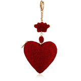 Red heart-shaped keychain coin purse with gold accents on a white background