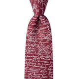 Red tie with black text pattern on a white background