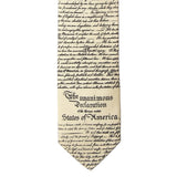 Close-up of a necktie with text of the Declaration of Independence on a white background