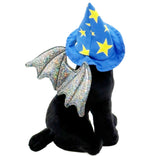 A black plush toy cat wearing a blue wizard hat with yellow stars and silver glittery wings, shown against a plain white background.