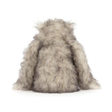 Plush toy resembling a creature with gray and white fur on a white background