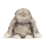 Plush toy resembling a fluffy creature on a white background