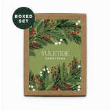 Boxed set of Holiday cards with greenery and berries design, labeled 'Yuletide Greetings'.