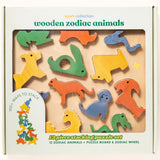 Wooden zodiac animals stacking puzzle set in its original packaging, featuring 12 colorful wooden animal pieces on a natural wood board with a white box.