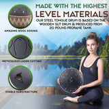 Woman holding a steel tongue drum with scenic background and material features highlighted.