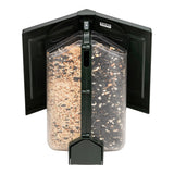 Bird feeder with seeds inside on a white background
