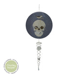 Decorative suncatcher with skull design on a white background, featuring the Charley Harper brand.